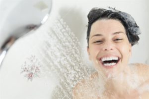 Woman smiling taking a shower