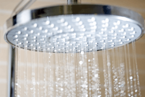 Water coming out of shower head in bathroom