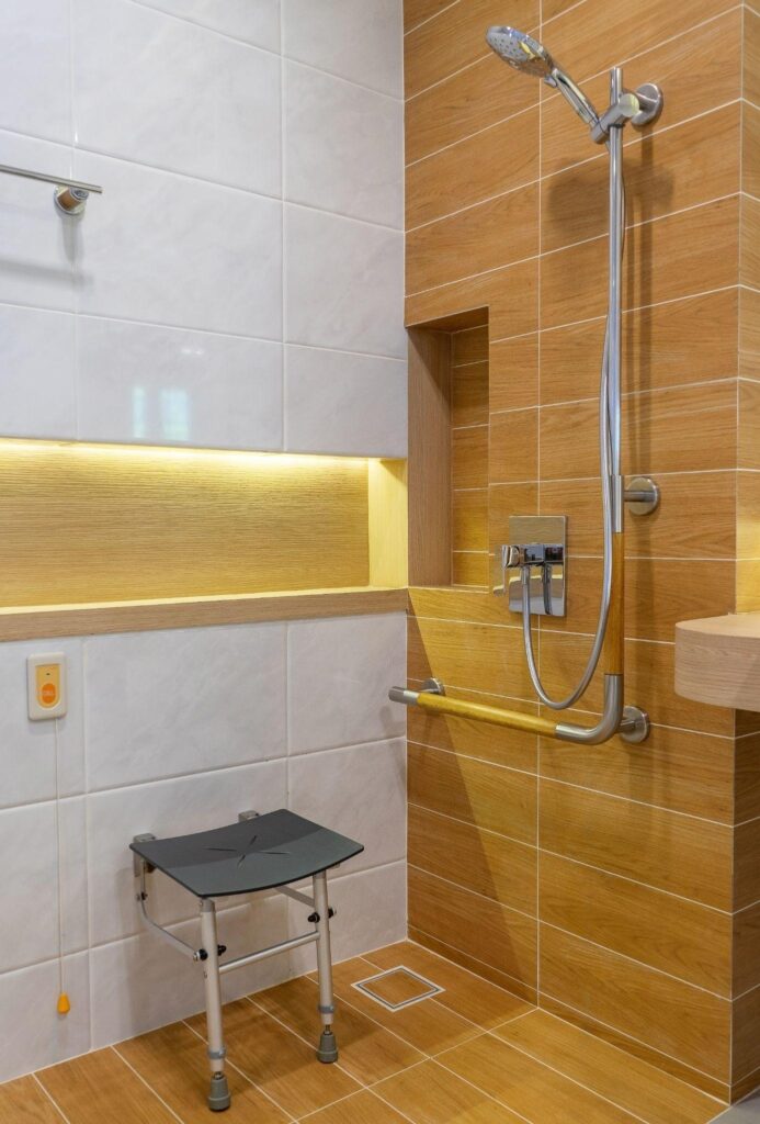 shower with seat and grab bars for disabled and elderly people in the bathroom