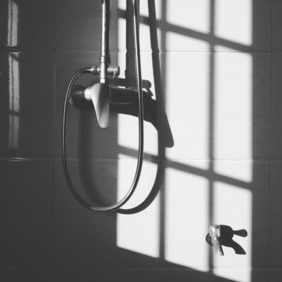 stainless steel shower head hanged on wall